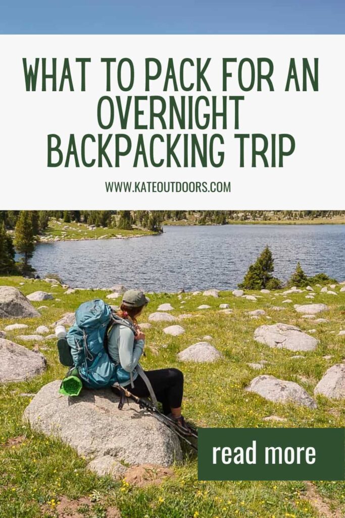 Photo of a woman sitting on a rock with a large blue backpacking pack staring at a lake with the text "what to pack for an overnight backpacking trip."