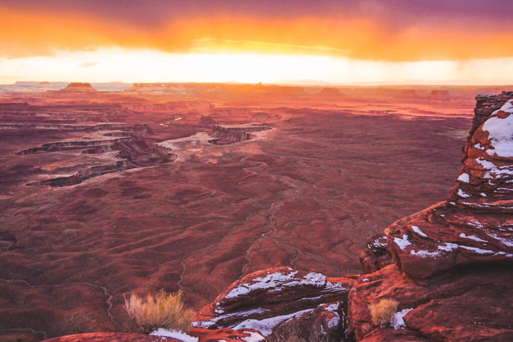 A vibrant sunset overlooking a canyon in the winter in Canyonlands 
National Park.