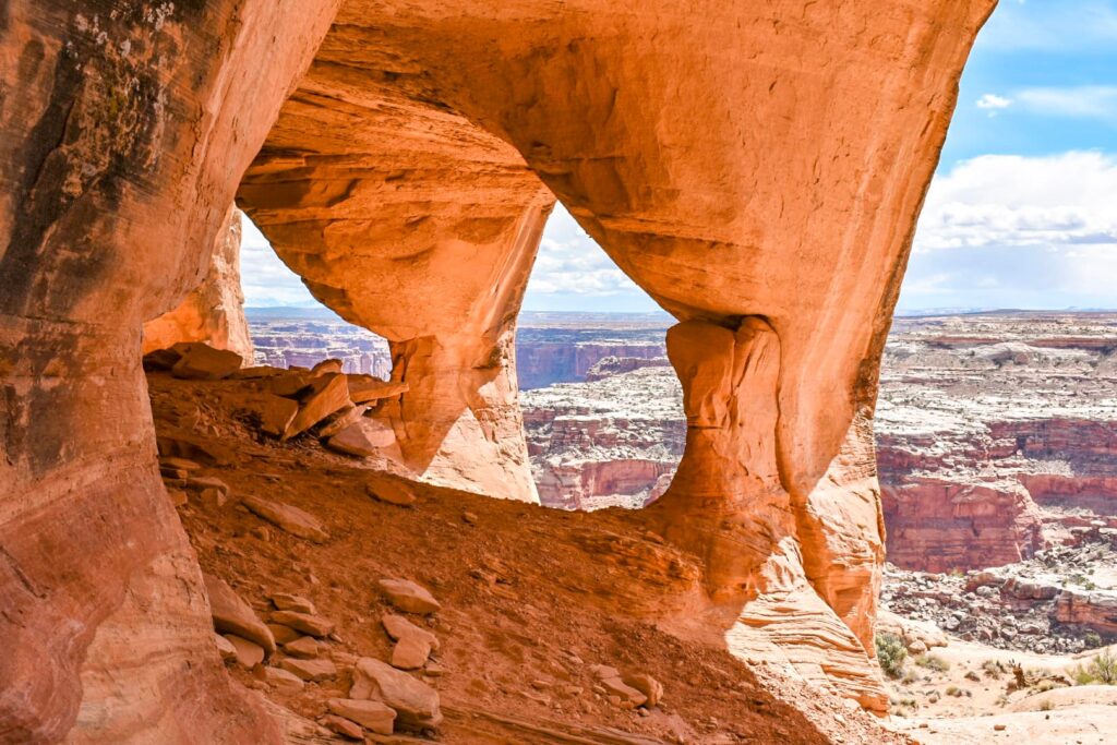 Multiple arches overlooking canyon country outside of Hanksville, Utah at Colonnade Arch.
